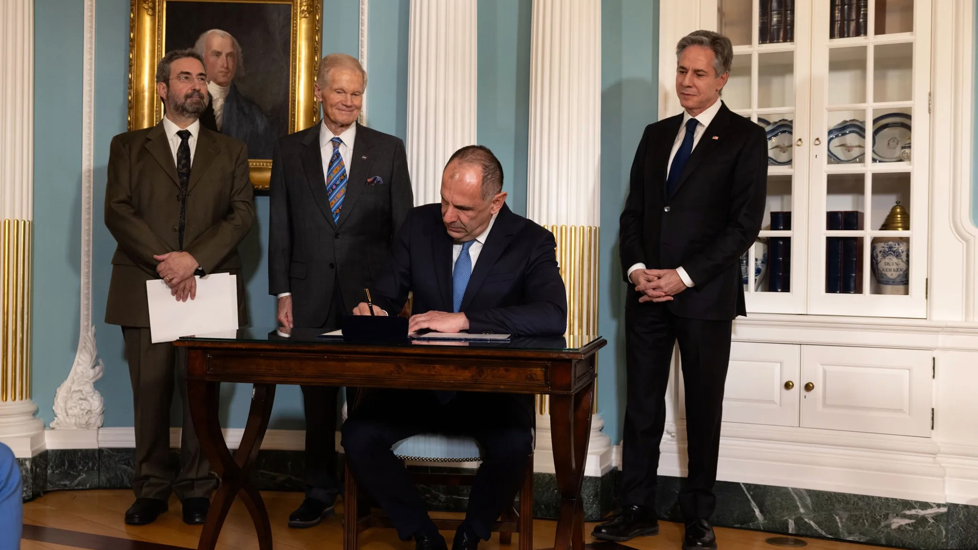 From left: Ioannis Daglis, president of the Hellenic Space Center, NASA Administrator Bill Nelson, and U.S. Secretary of State Antony Blinken watch as Giorgos Gerapetritis, Greek foreign minister, signs the Artemis Accords on the margins of the U.S.-Greece Strategic Dialogue at the Department of State in Washington, Feb. 9, 2024.