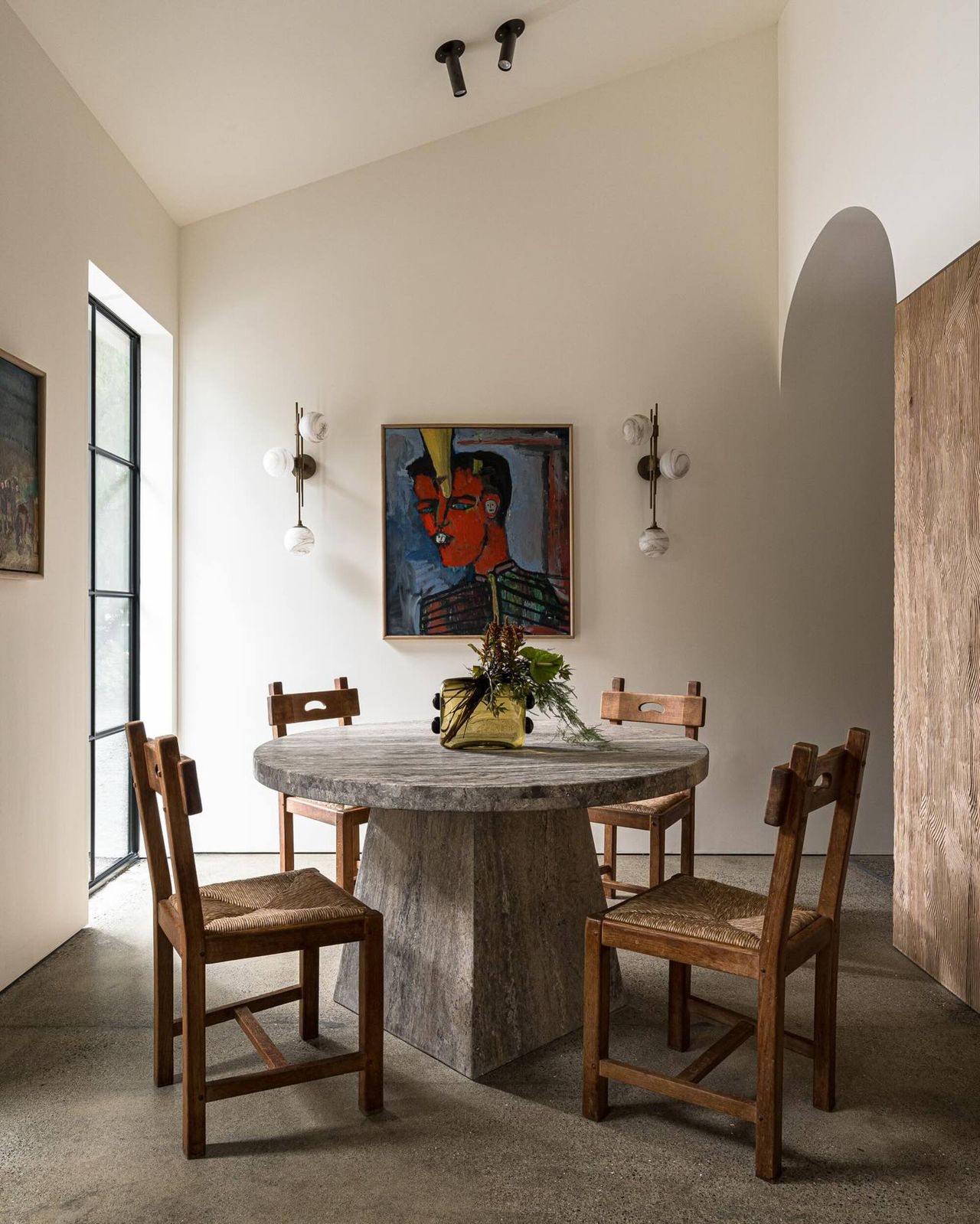 dining room with a stone table and wooden chairs