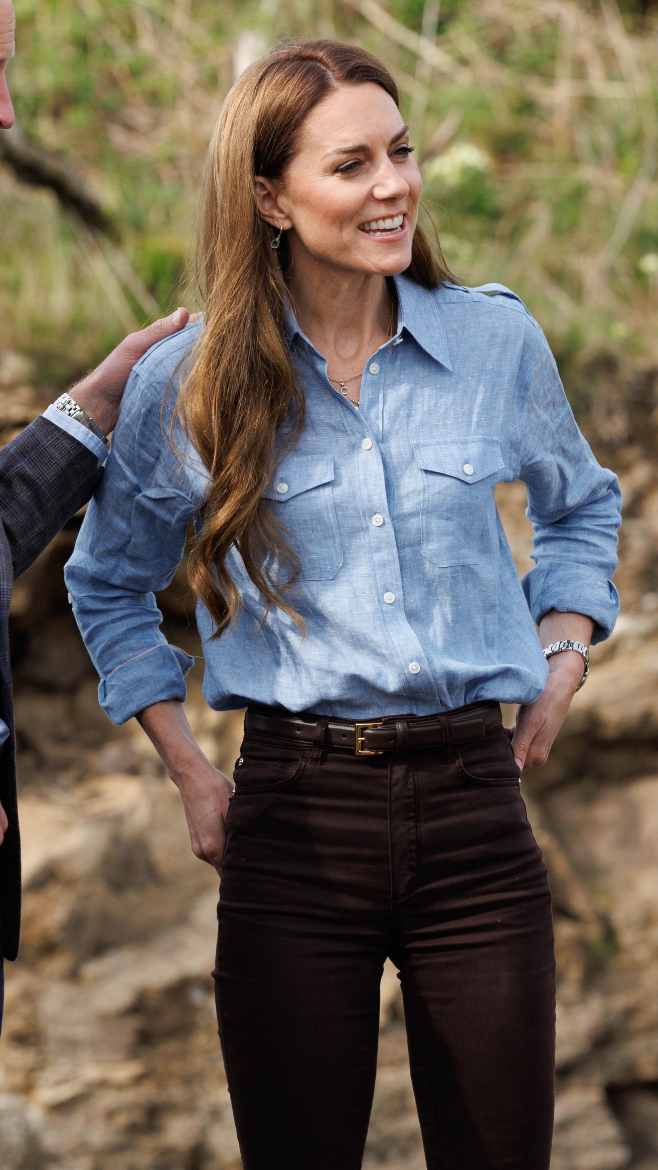 Catherine, Princess of Wales stands with her hands on her hips during their visit to a local croft on the west coast of Mull to learn about sustainable production and the hospitality industry on the islands on April 29, 2025