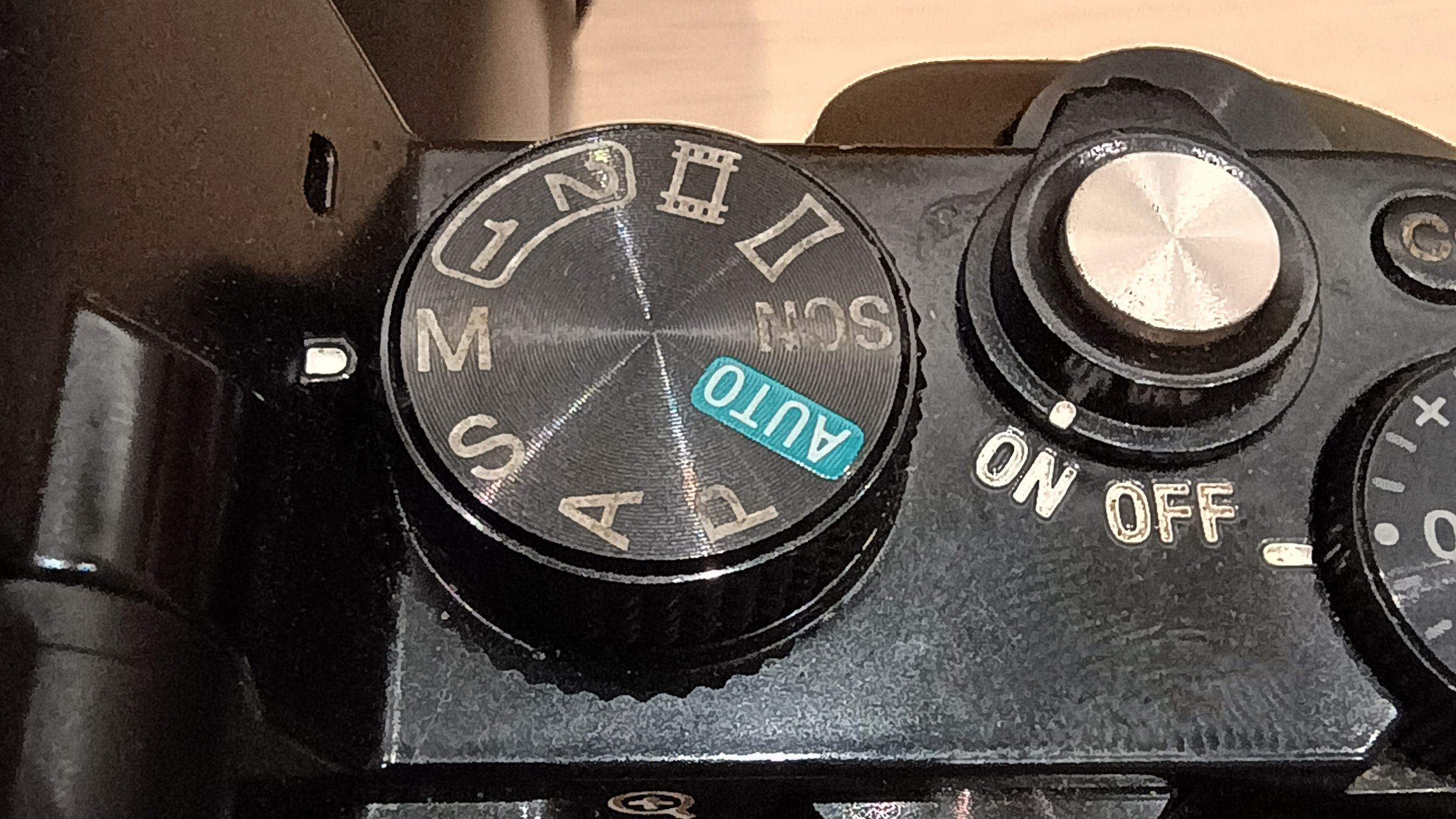 Camera body showing mode wheel in Manual mode