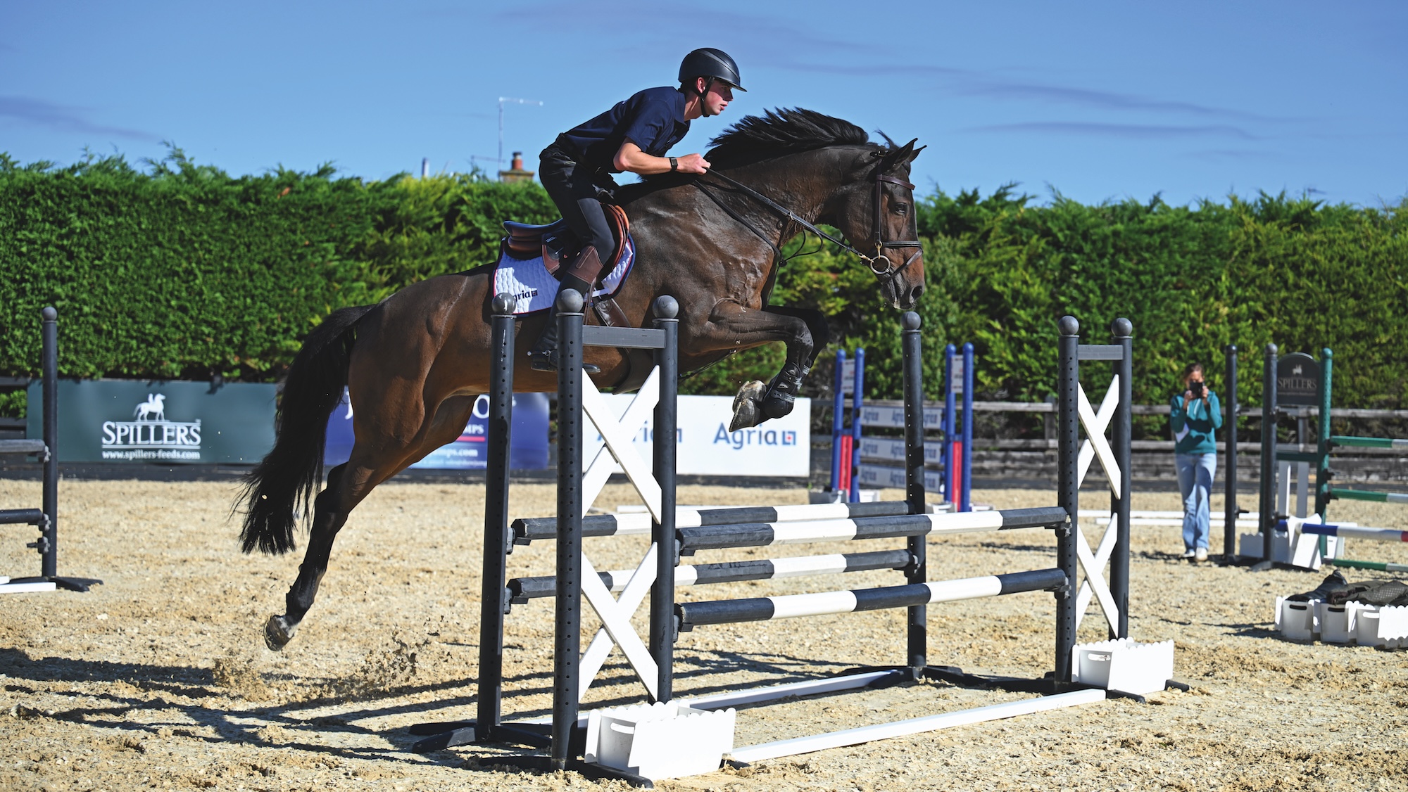 Joe Stockale over oxer in jumping exercise