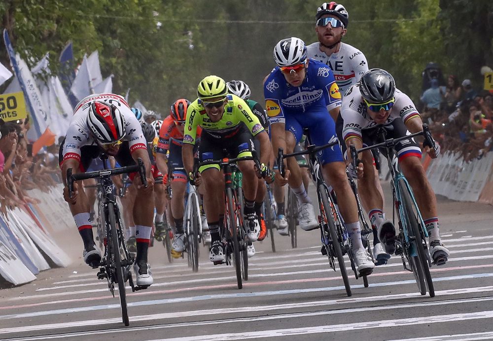 Simone Consonni celebrates Fernando Gaviria beating Peter Sagan during stage 4 in San Juan