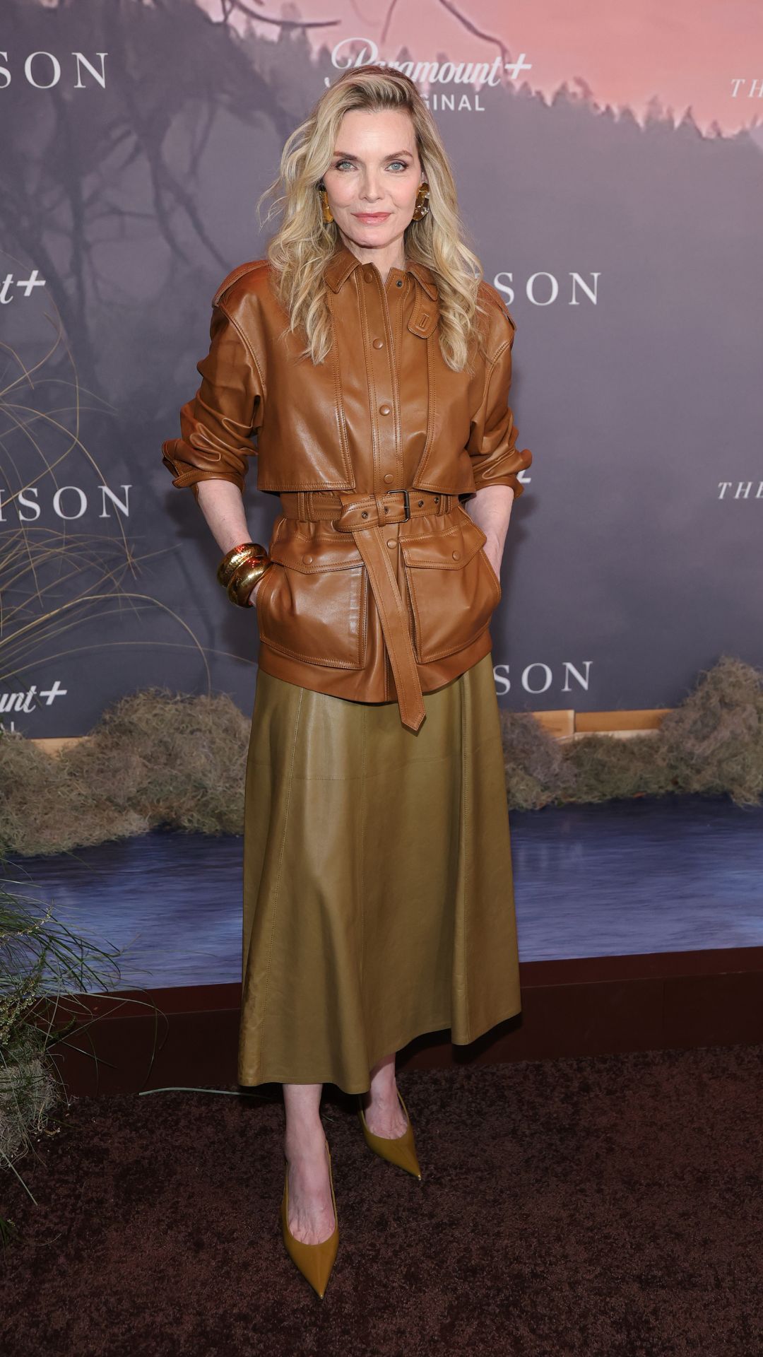 michelle pfeiffer wearing a leather jacket and skirt