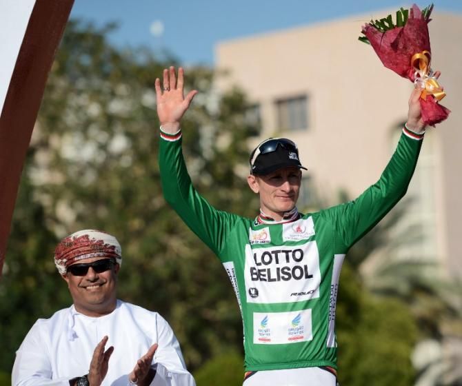 Germany's Andre Greipel (R) of Lotto Belisol team celebrates after receives the green jersey, awarded to the rider who is leading the overall points ranking
