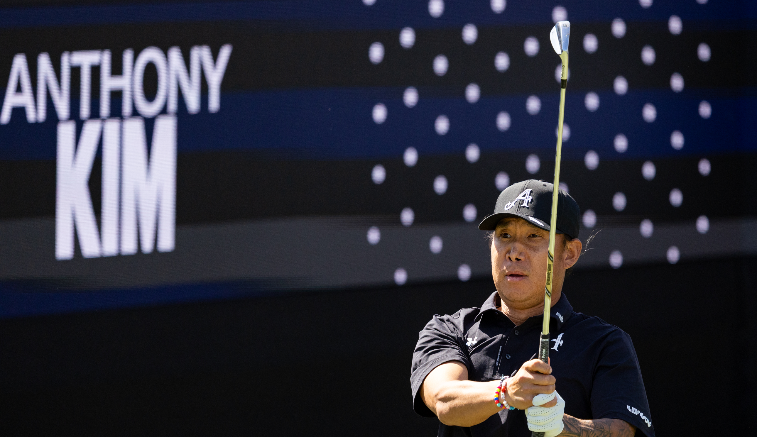 Anthony Kim hits a wedge off the tee