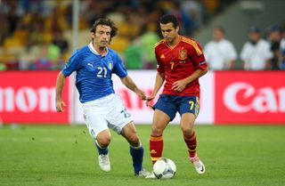 Spain's Pedro (right) is challenged by Italy's Andrea Pirlo in the final of Euro 2012.