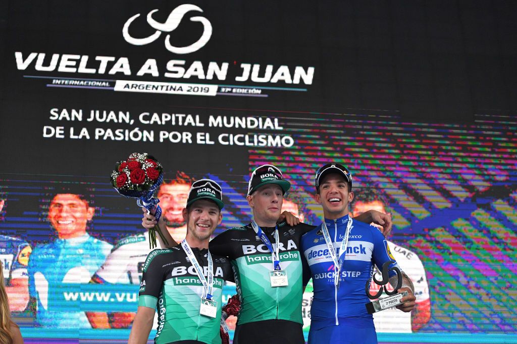 The stage podium (L-R) Erik Baska, Sam Bennett and Alvaro Hodeg