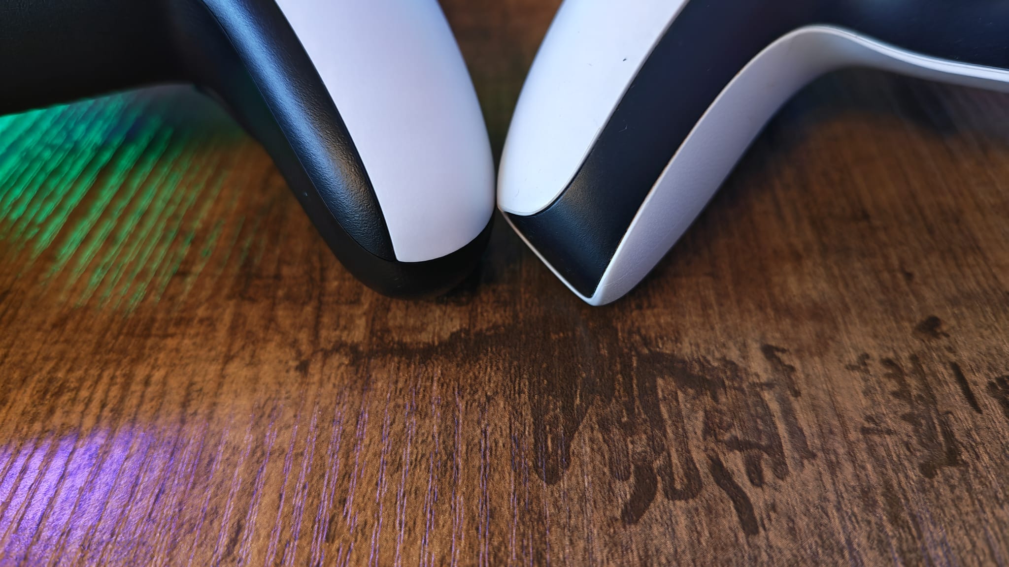 The rounded corners of the Hyperkin Competitor compared with an original DualSense