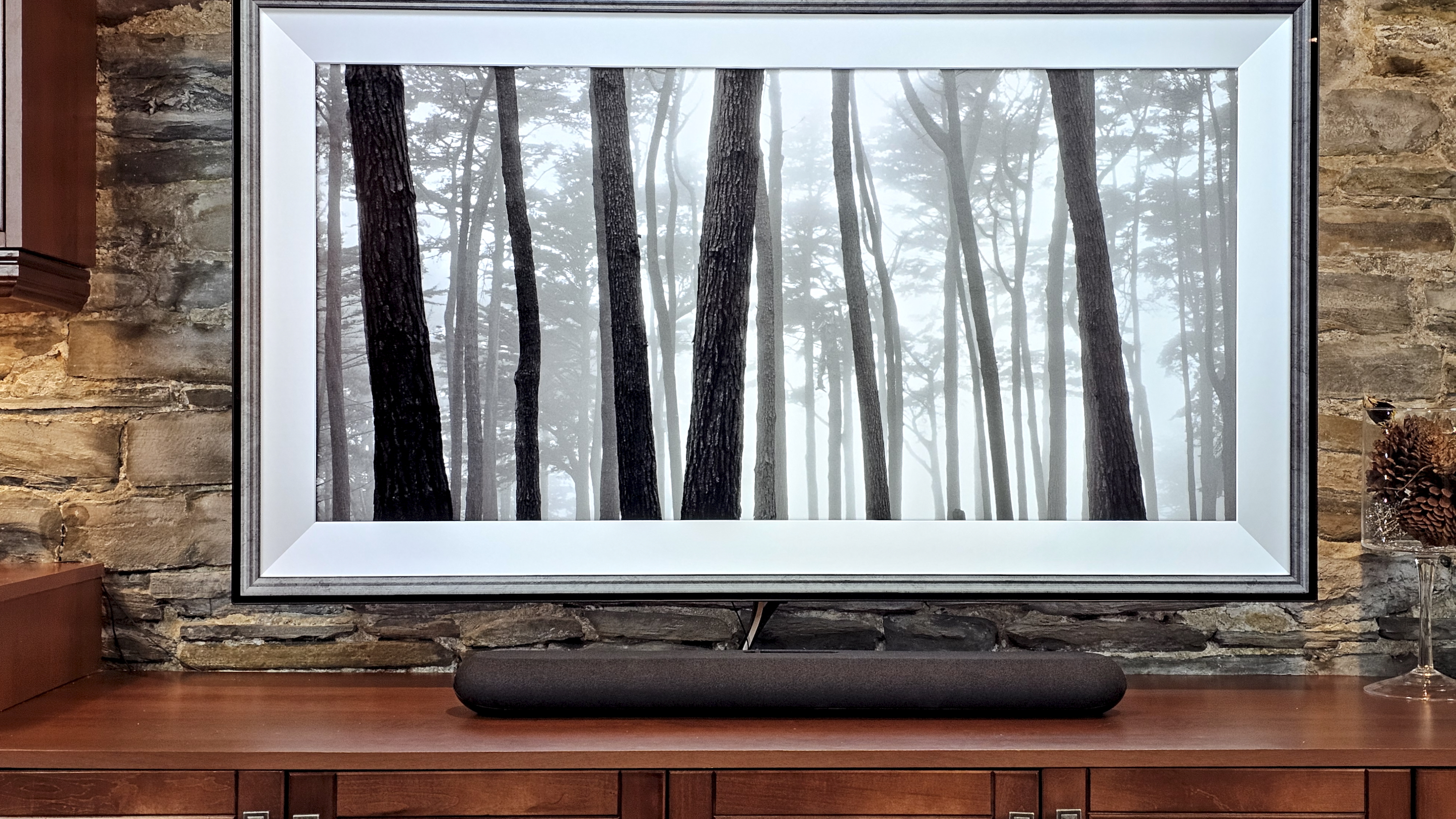 The Bluesound Pulse Mini soundbar underneath a TV