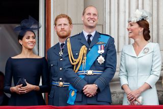 Meghan, Duchess of Sussex, Prince Harry, Duke of Sussex, Prince William, Duke of Cambridge and Catherine, Duchess of Cambridge watch a flypast to mark the centenary of the Royal Air Force