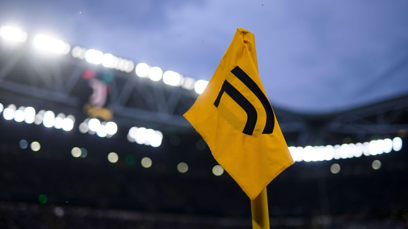 The Juventus badge on a yellow corner flag at the club&#039;s stadium