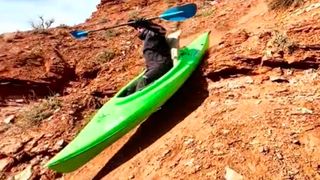 MTB rider Bradon Sweeney makes Red Bull Rampage descent in a kayak