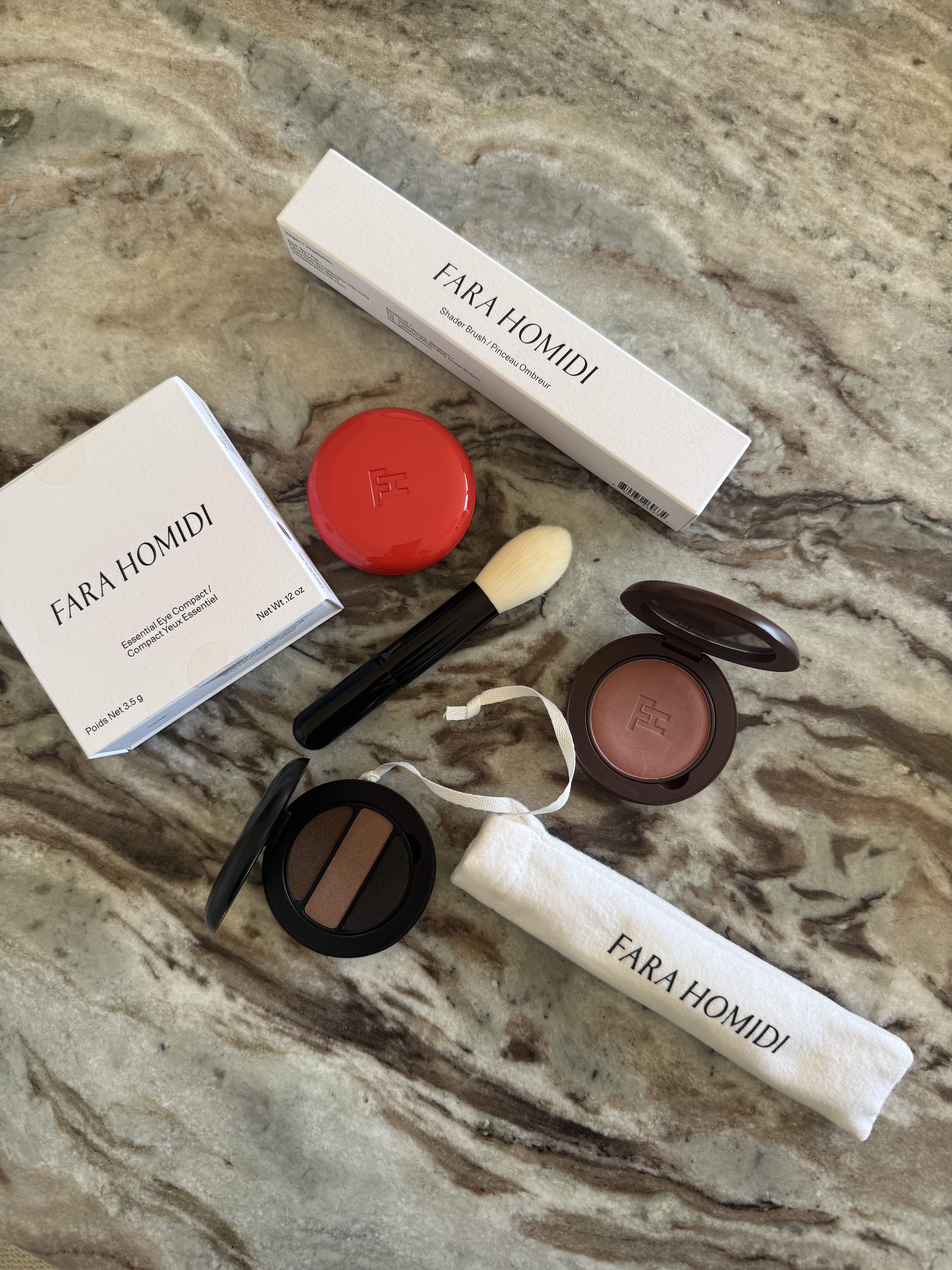 A selection of Fara Homidi makeup products