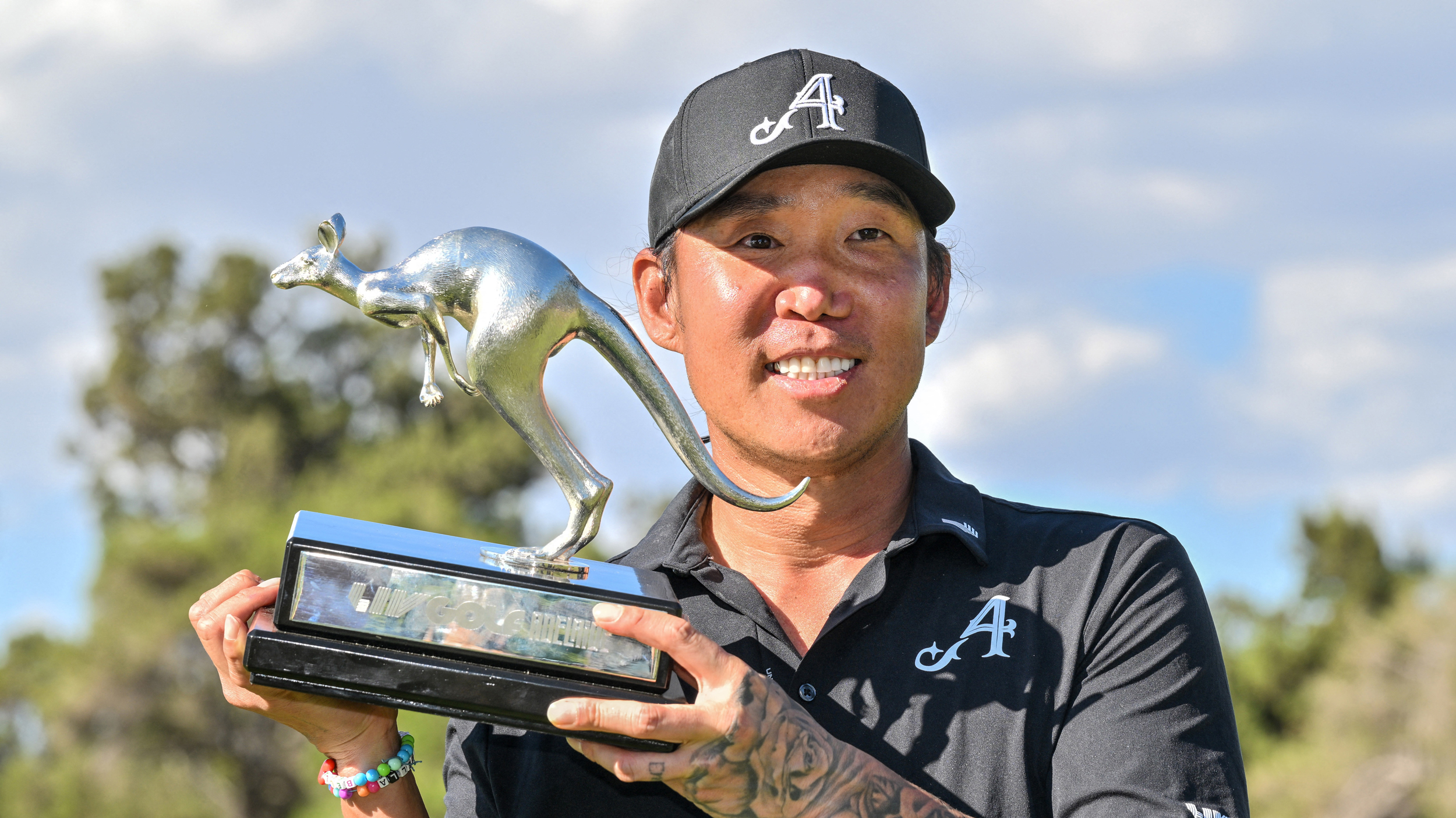 Anthony Kim poses with the LIV Golf Adelaide trophy