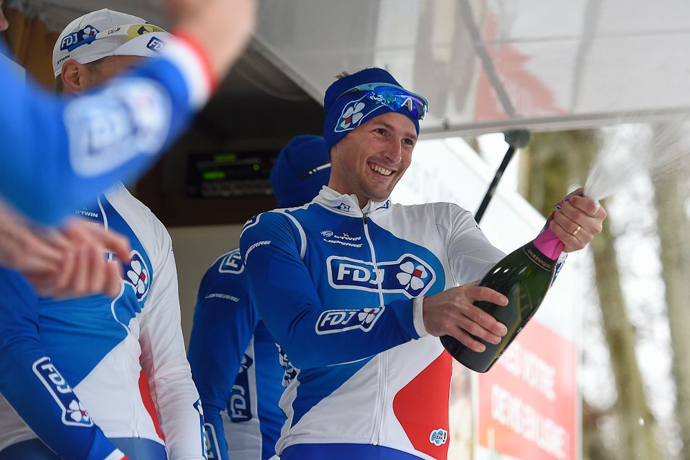 Mickael Delage, of FDJ, sprays champagne to celebrate