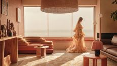 photoshoot of a desert-inspired color scheme with modern furniture and a model wearing fashionable clothes 