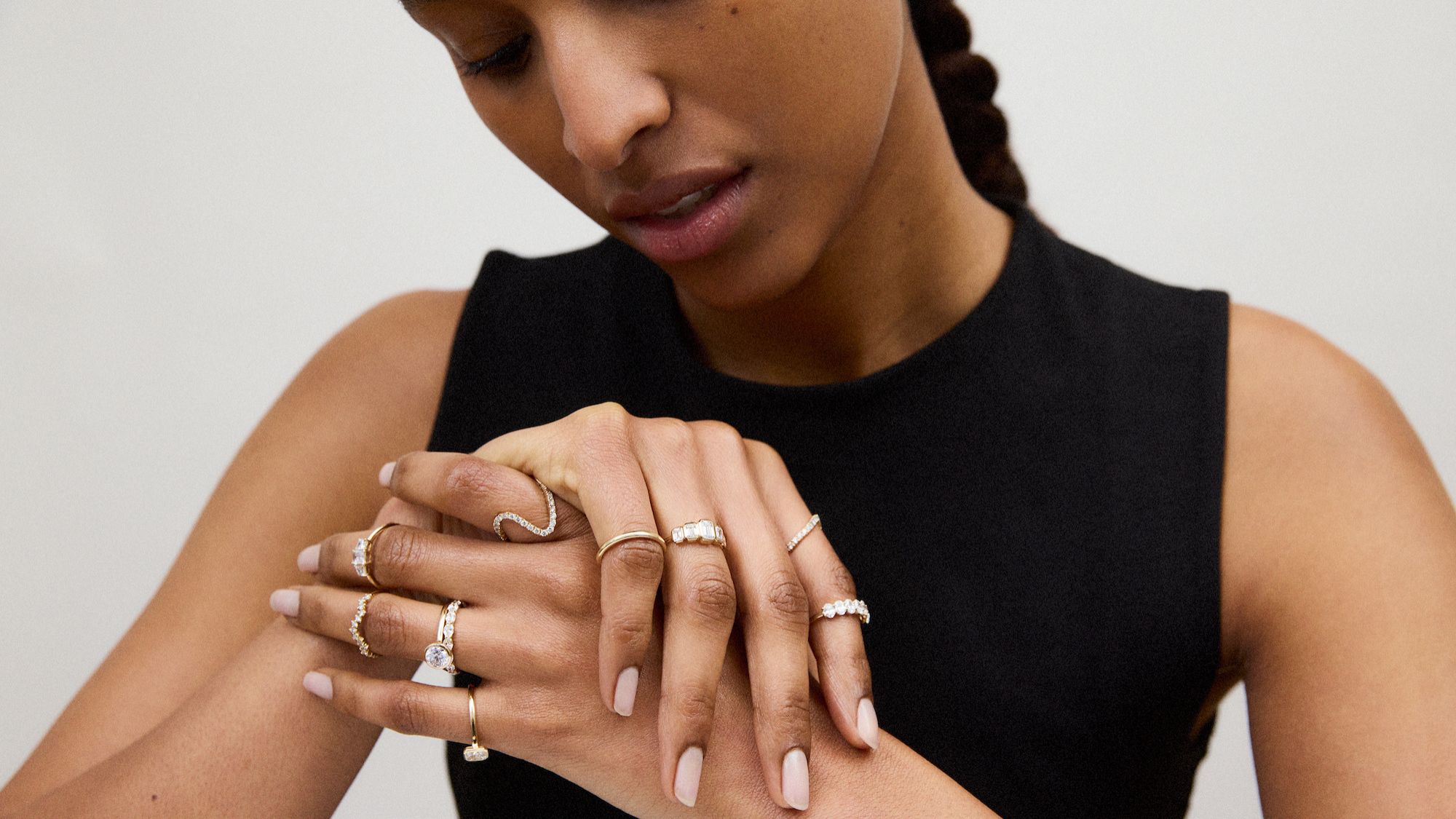 Best jewellery cleaning machines- a woman wearing a stack of rings