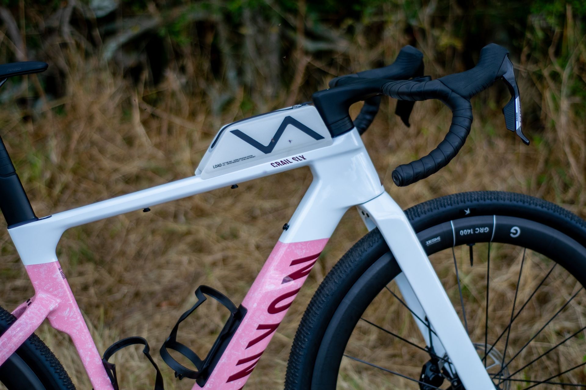A Canyon Grail CF SLX 8 in the 'strawberry shake' colour 