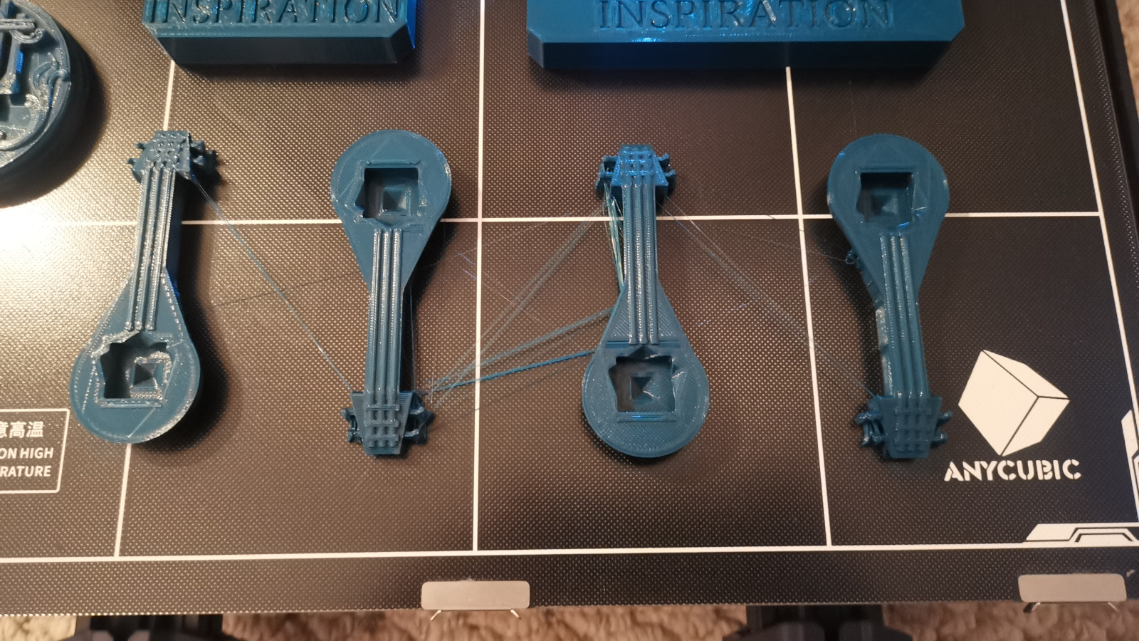 Models printed on the Anycubic Kobra Max printer showing stringing