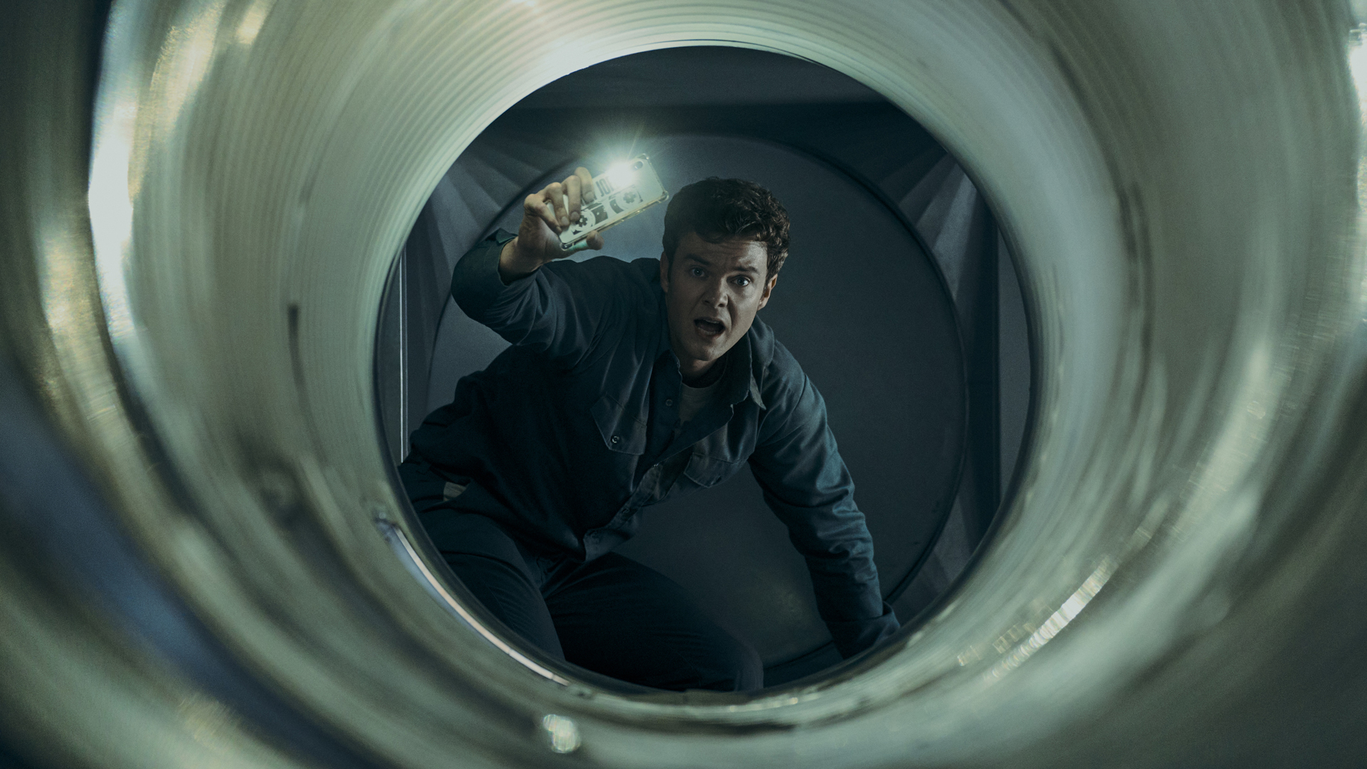 Hughie looks shocked as he crawls through a vent duct in The Boys season 4