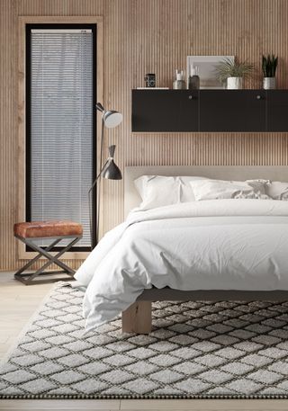 Scandi bedroom with wall-mounted Ikea Malm chest with joan black dresser fronts from Norse Interiors