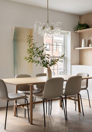 an apartment dining room with simple roller blinds
