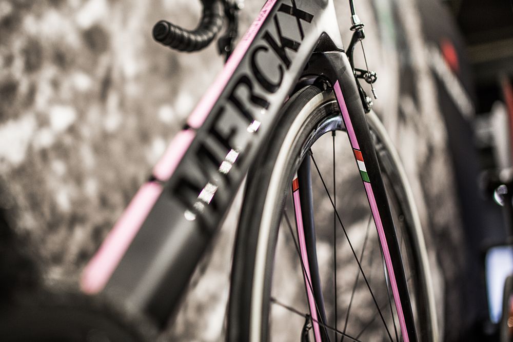 A sleek matte-black paint job with gloss black logo and pink racing stripes is quintessentially Italian