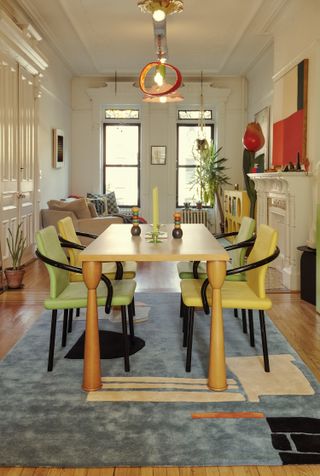 Colorful dining table and chairs on a rug
