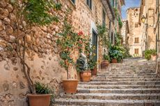 One of the gorgeous old town alleys in the village of Fornalutx, Mallorca. Credit: Christian Mueringer / AWL