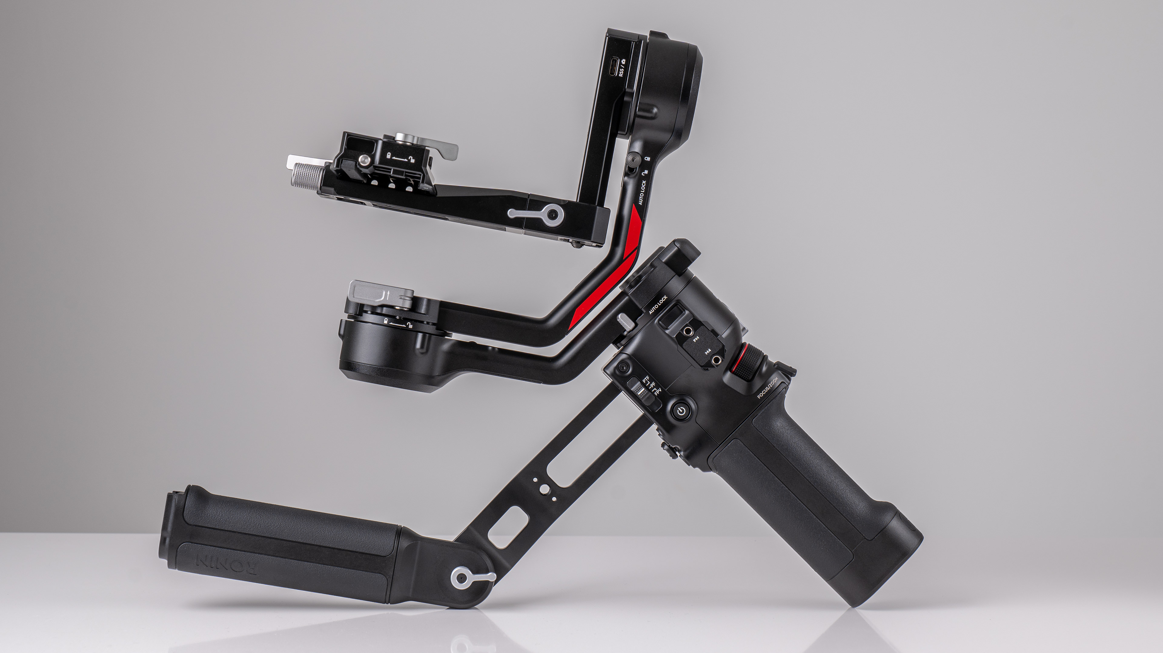 DJI RS 4 gimbal on a off-white background no camera attached