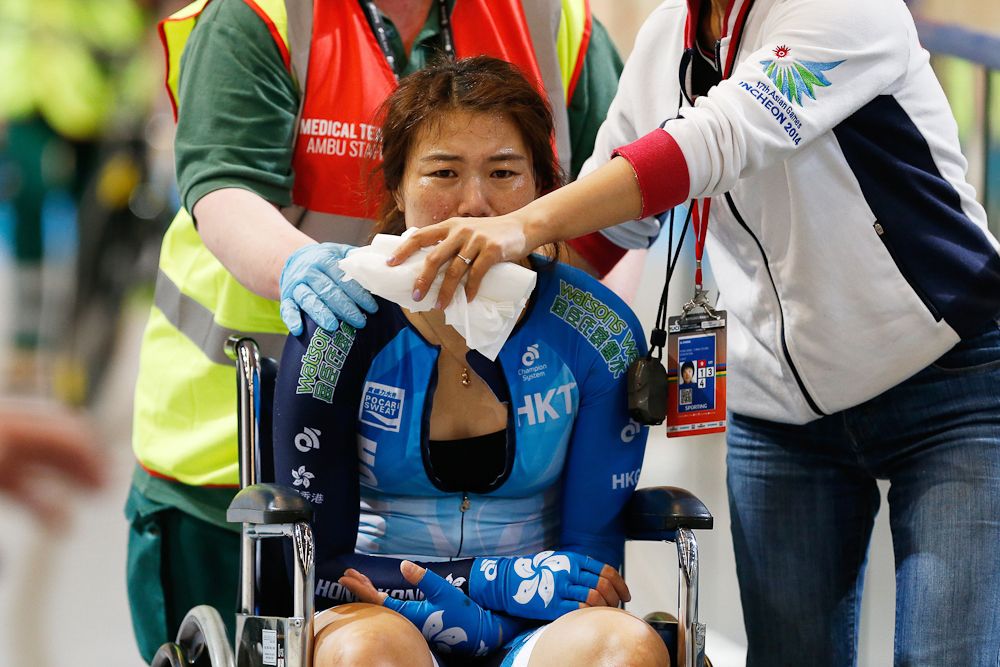 Hong Kong's Xiaojuan Diao cries after crashing with a jury member during the women's Omnium at the UCI Track Cycling World Championships