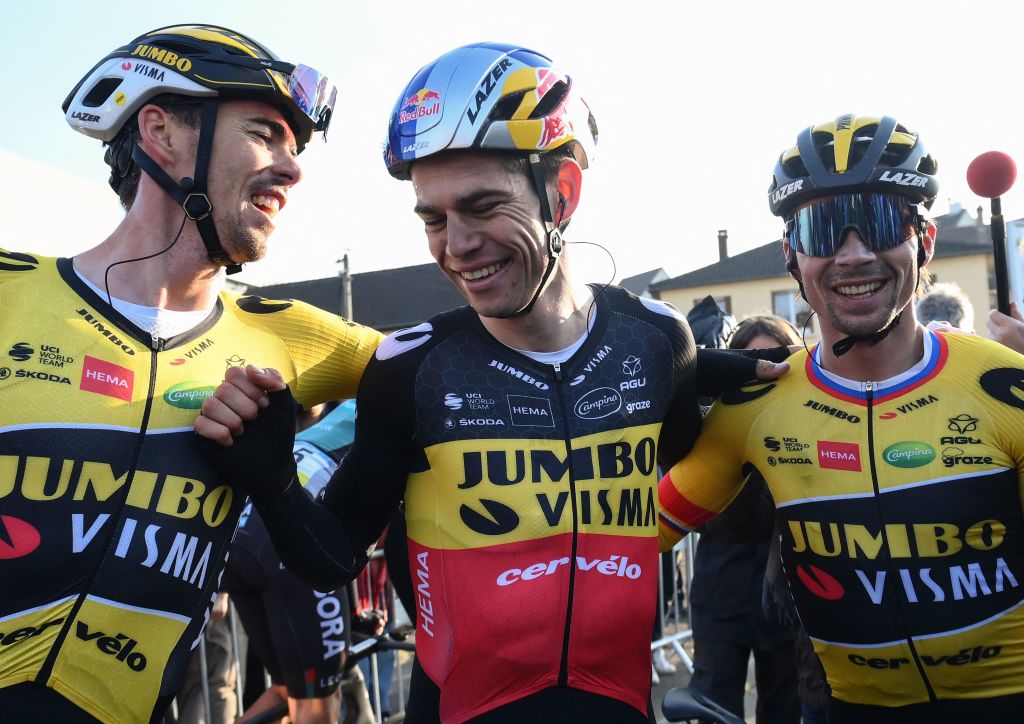 JumboVismas French rider Christophe Laporte L JumboVismas Belgian rider Wout Van Aert C and JumboVismas Slovenian rider Primoz Roglic R celebrate after crossing the finish line at the end of the 1st stage of the 80th Paris Nice cycling race 160 km between ManteslaVille and ManteslaVille on March 6 2022 Photo by FRANCK FIFE AFP Photo by FRANCK FIFEAFP via Getty Images