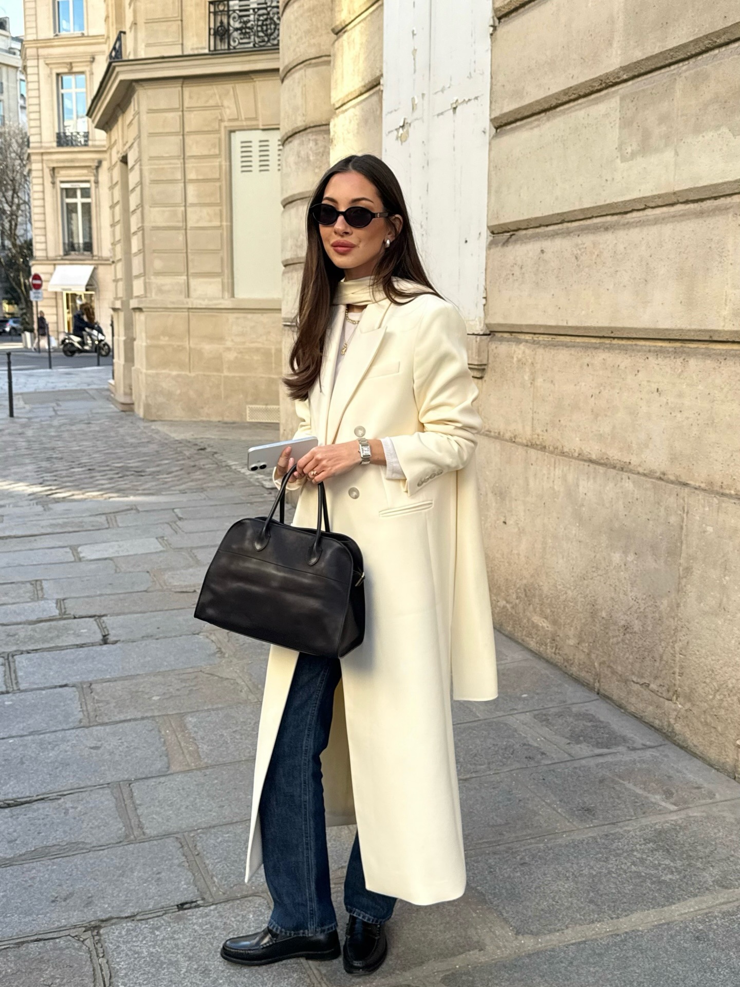 Influencer holding The Row Margaux
