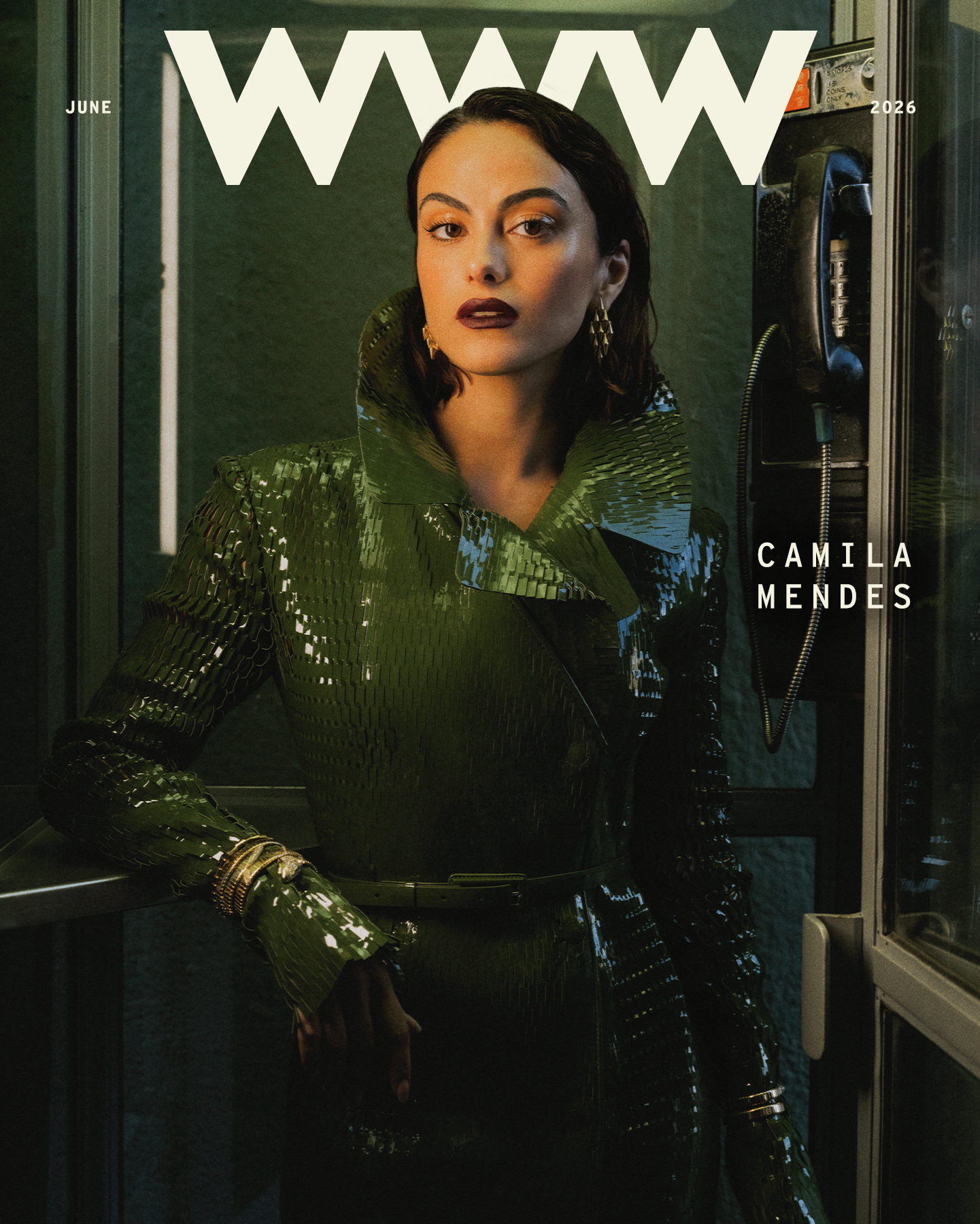 Camila Mendes wears a green trench coat