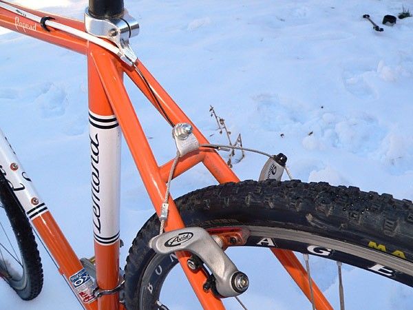 The rear brake is routed through a neatly integrated housing stop