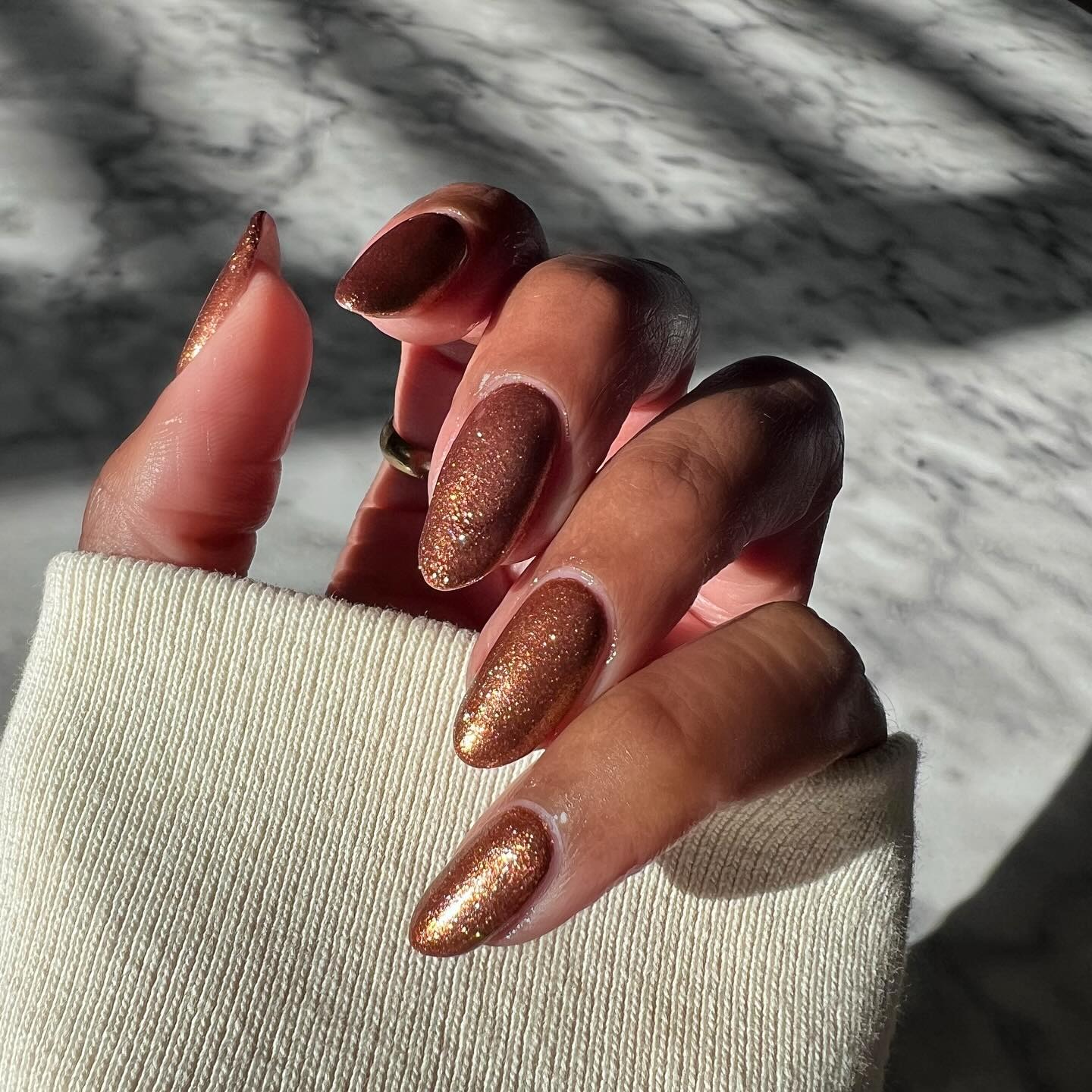 brown glitter manicure
