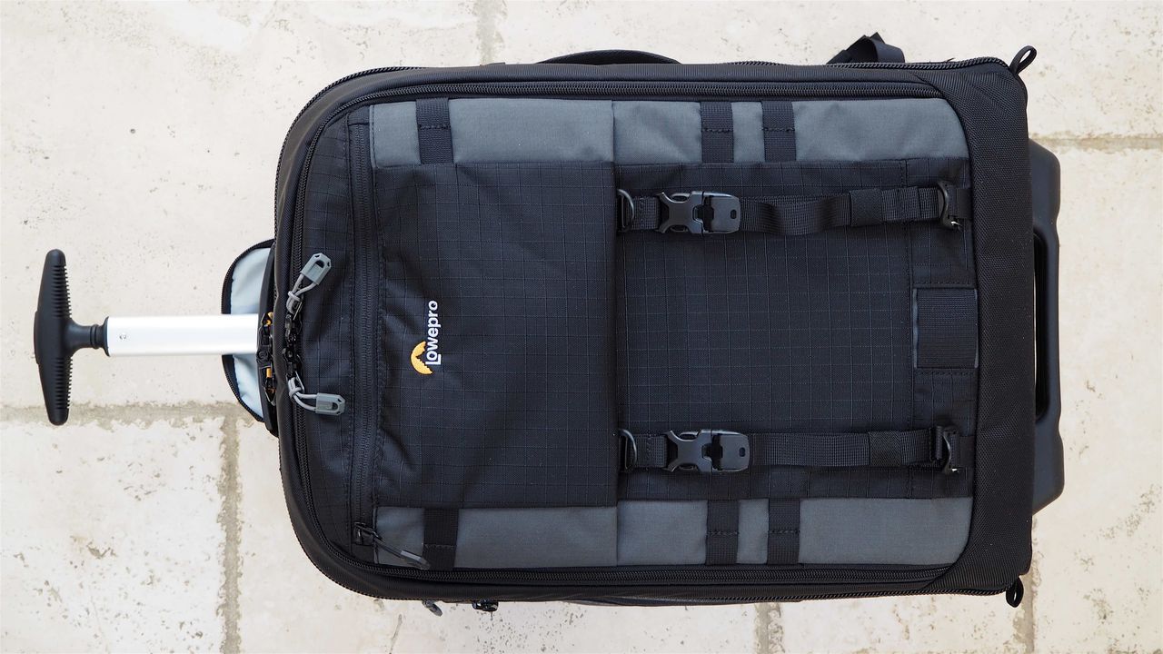 Lowepro Pro Trekker RLX 450 AW II roller backback on a light stone floor