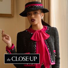 Whitney Peak stands in front of a wall in her hotel wearing a custom chanel look