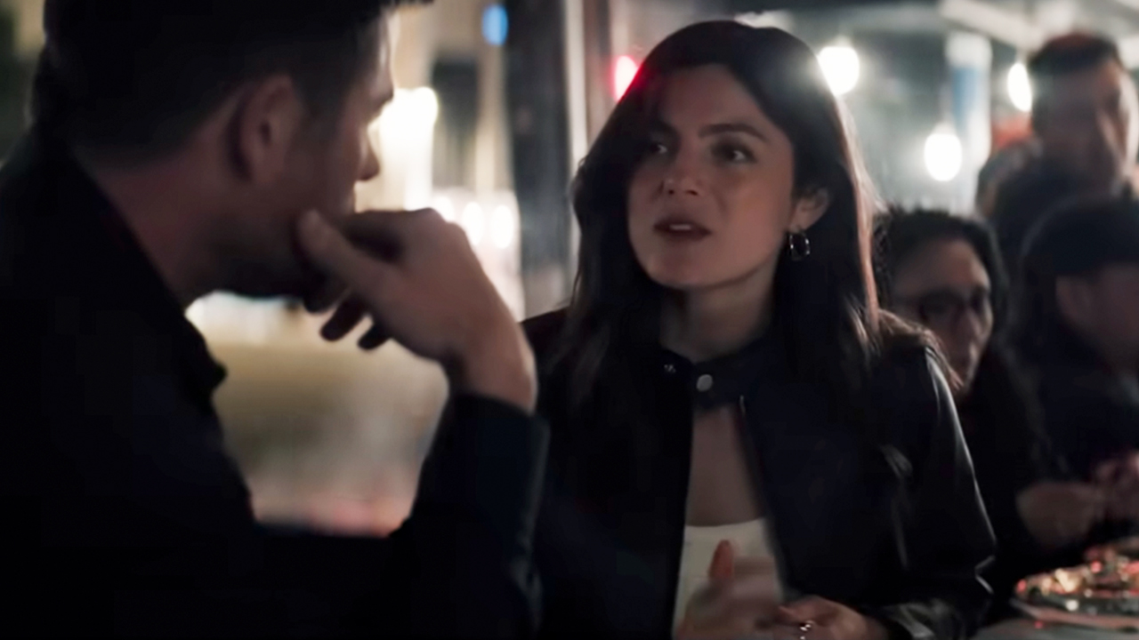 Monica Barbaro talking to Chris Hemsworth in Crime 101