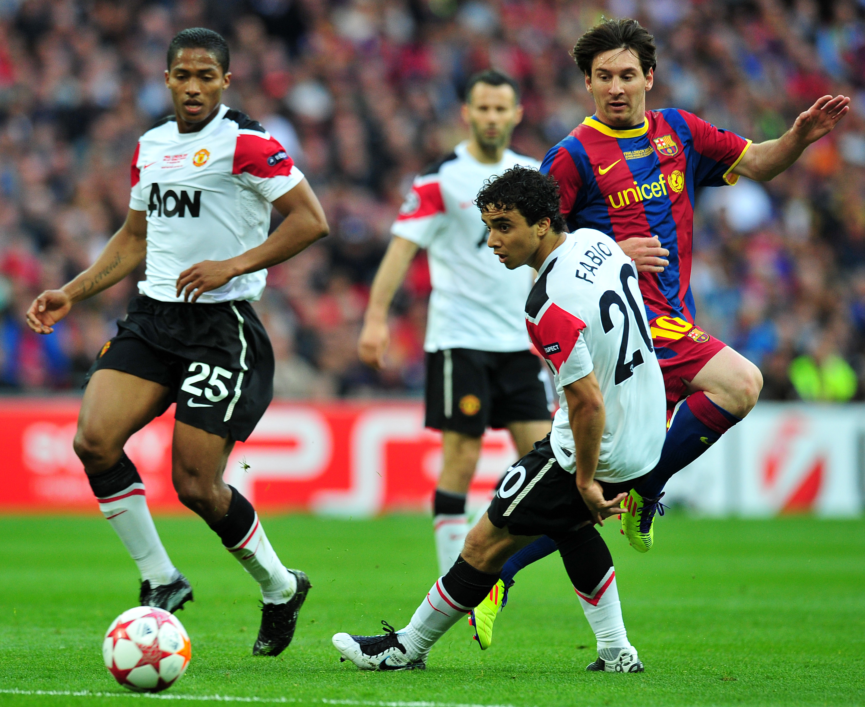 Fabio da Silva tries to deal with Lionel Messi in the 2011 Champions League final