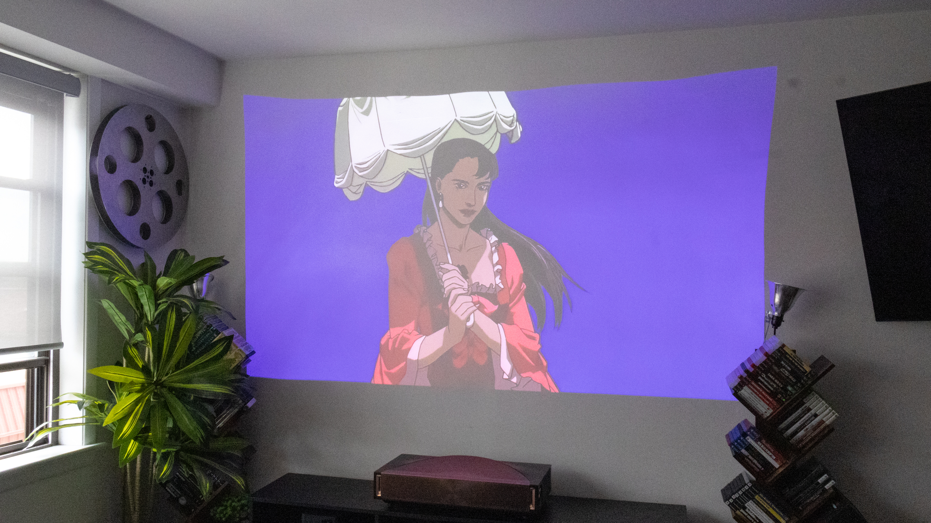 The Hisense L9Q UST projector in a living room
