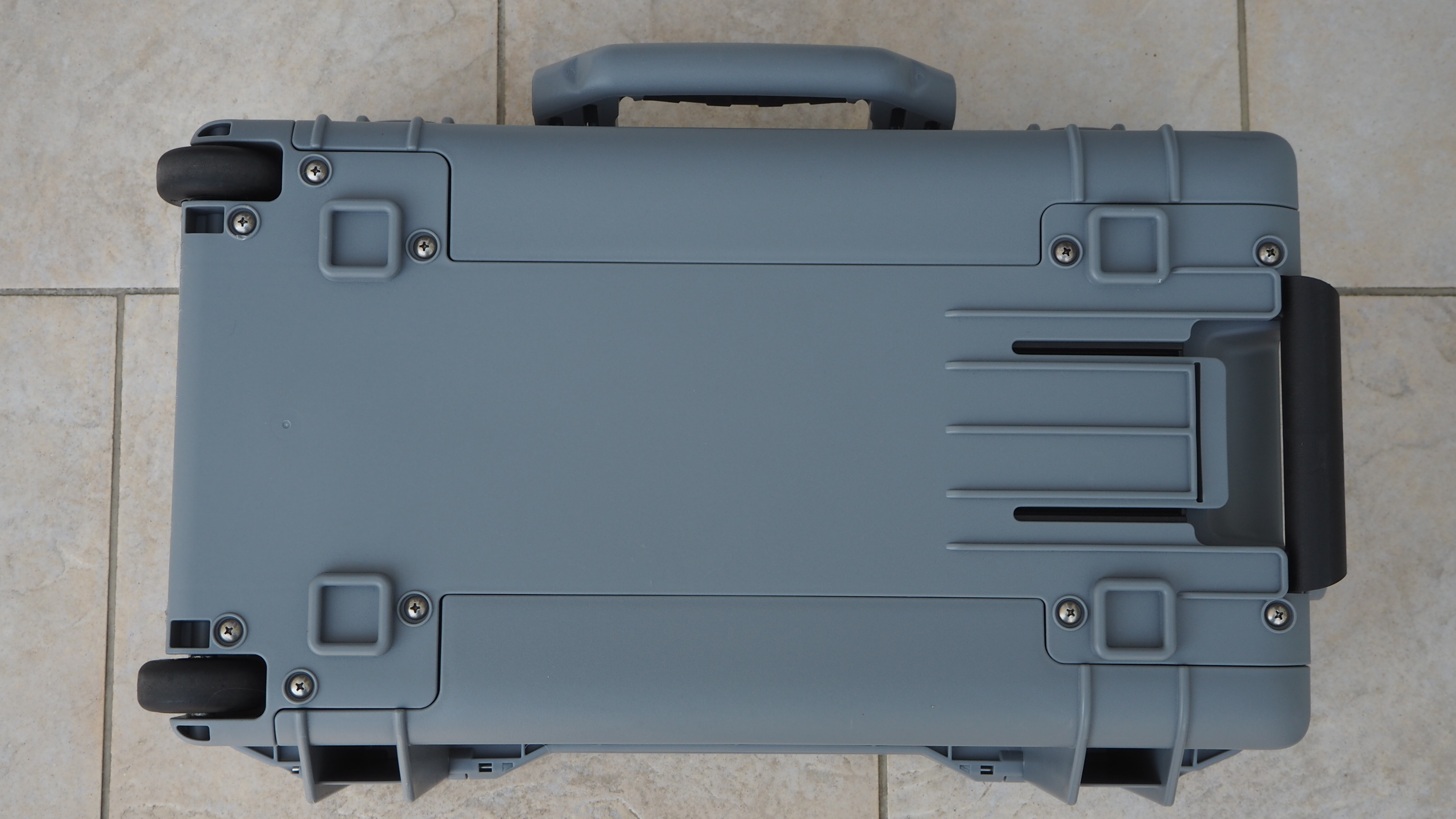 Peli 1535 Air case in grey on a flagstone floor