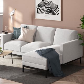 Zinus sectional sofa in a living room with pink walls