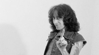 Bon Scott wagging his finger at the camera