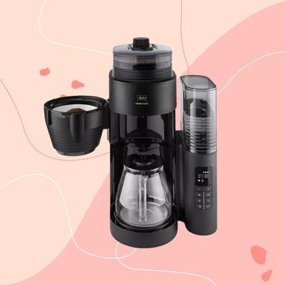 Melitta coffee machine on pink background