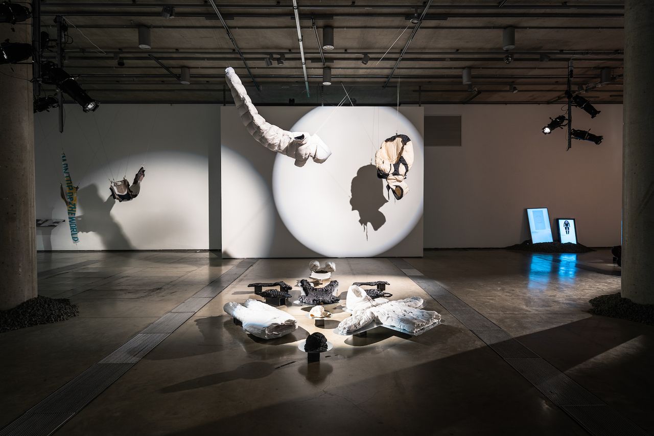 Inside of Canada Goose exhibition with hanging puffer jacket