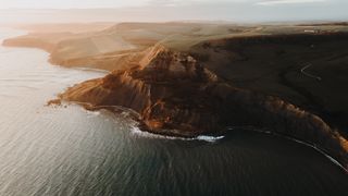 Mountains at the coast and the sea from a bird's point of view