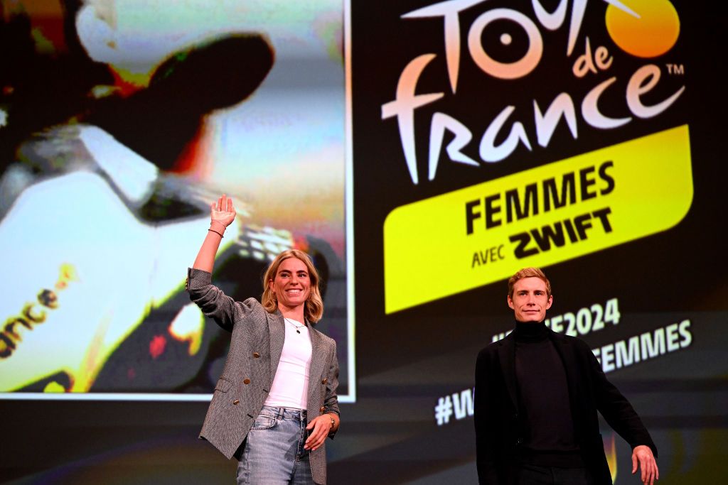 PARIS FRANCE OCTOBER 25 LR Demi Vollering of The Netherlands and Team SD Worx and Jonas Vingegaard of Denmark and Team JumboVisma during the 111th Tour de France 2024 3rd Tour de France Femmes 2024 Route Presentation UCIWT UCIWWT on October 25 2023 in Paris France Photo by Dario BelingheriGetty Images