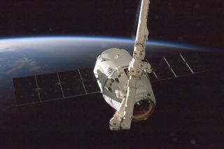 The SpaceX Dragon commercial cargo craft is grappled by the International Space Station's Canadarm2 robotic arm on Oct. 10, 2012 during the spacecraft's first cargo delivery mission for NASA under a $1.6 billion deal for commercial cargo delivery.