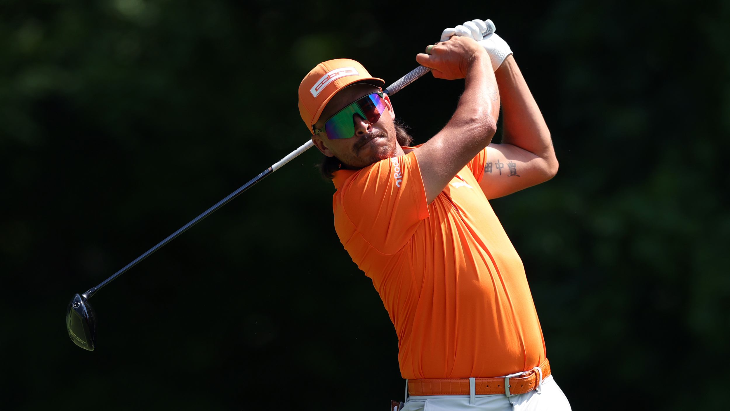 Rickie Fowler holds his finish on a drive